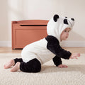 Select Panda one-piece on child in playful side view on an oat rug, attached panda hood and open ankle cuffs.
