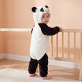 Select Panda one-piece on child in a supported standing pose in a peach nursery, attached panda hood and open ankle cuffs.